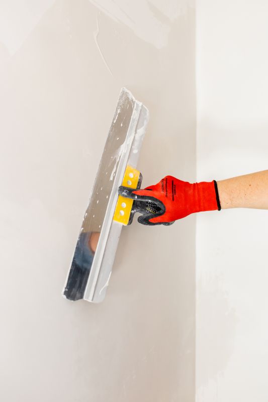 Handyman Painting a Wall